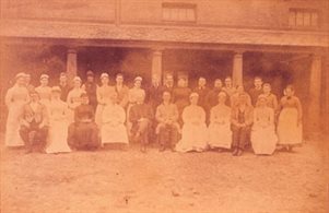 Photograph of the servants assembled in the colonade in the mid 19th century